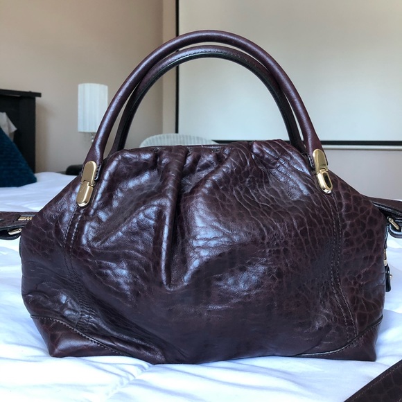 Nina Ricci - Burgundy leather bag.